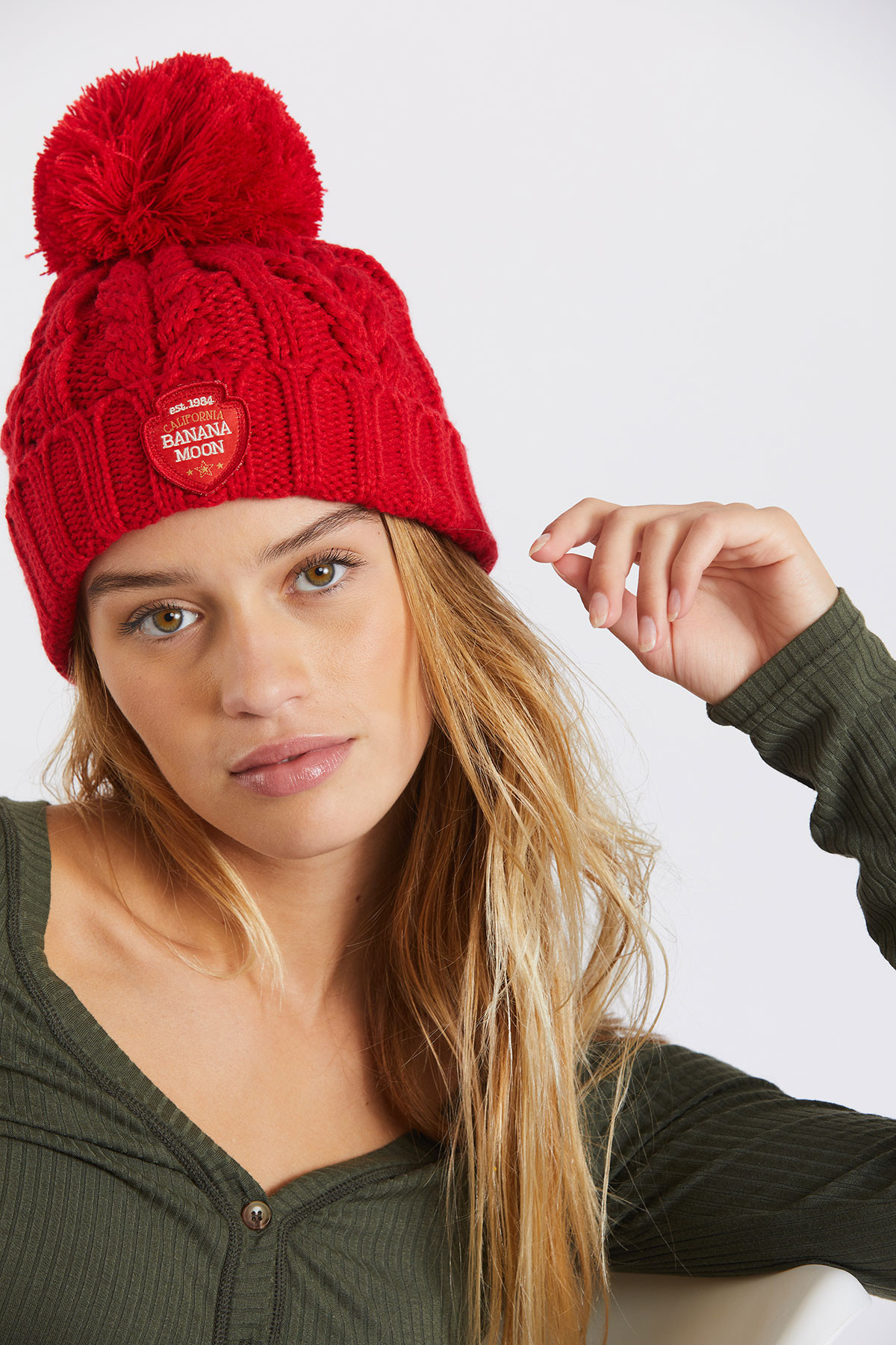 Women's red cable knit pompom beanie 