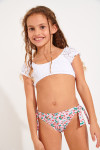 Parte inferior de bañador de niña rosa con cerezas estampadas anudado MINI MACHA BRIEF