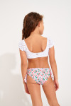 Parte inferior de bañador de niña rosa con cerezas estampadas anudado MINI MACHA BRIEF