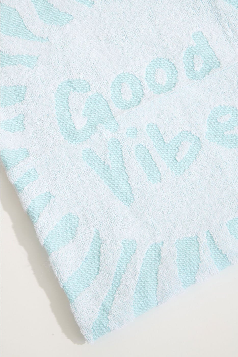 RENATA FOUTASLY turquoise stranddoek met seventies-print 